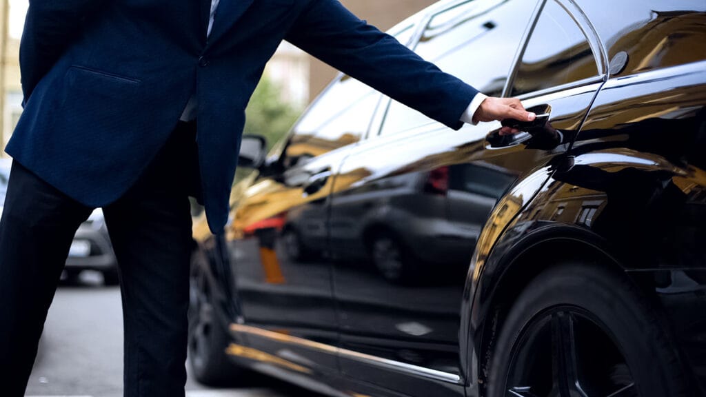man opening car door